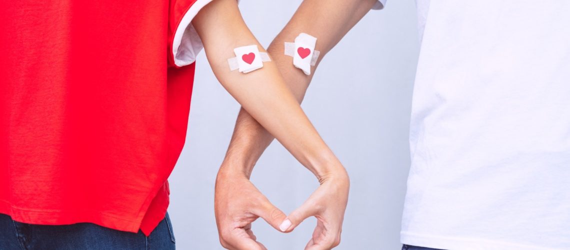 blood-donation-man-woman-showing-heart-shape-with-hands-after-giving-blood-save-lives-concept (1)