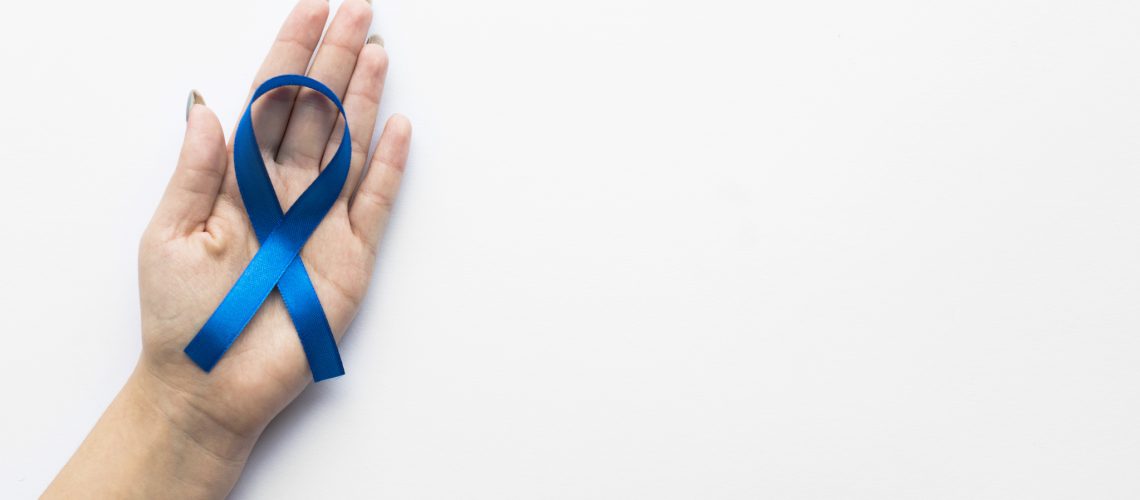 crop-hand-with-colon-cancer-ribbon (2) (1)