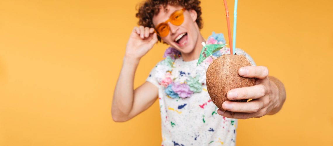happy-young-guy-sunglasses-showing-coconut-cocktail (2)